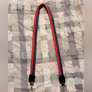Blue and red Clare V bag strap